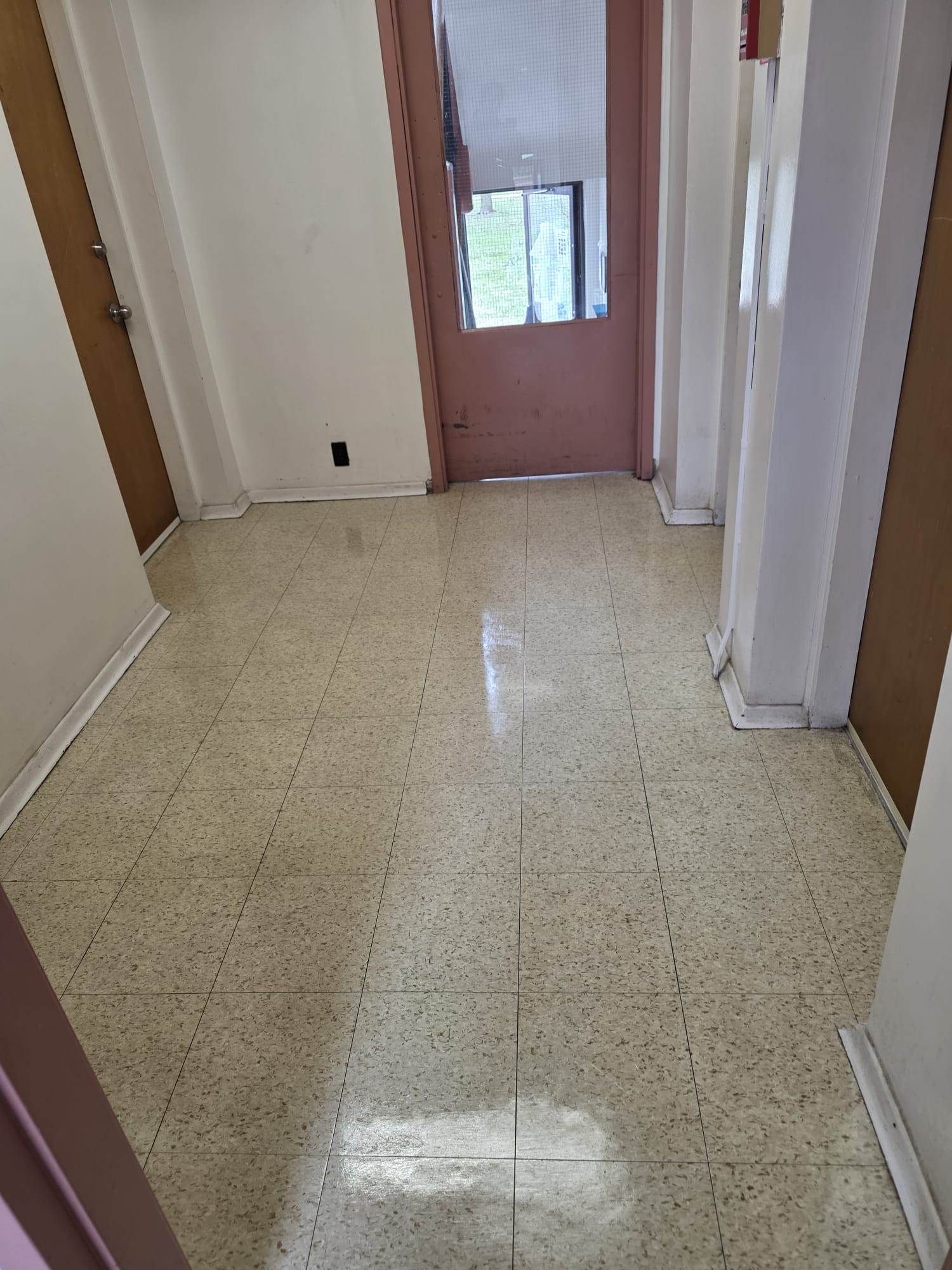 Gleaming hallway floor after strip and wax